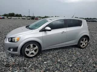 2012 Chevrolet Sonic LTZ с VIN 1G1JE6SH7C4123988, выставлен на аукционе Copart как лот 64845065 с пробегом 130 139 миль миль и Списание • Salvage title. История ставок и продаж доступна на DreamBid. Изображение 1.