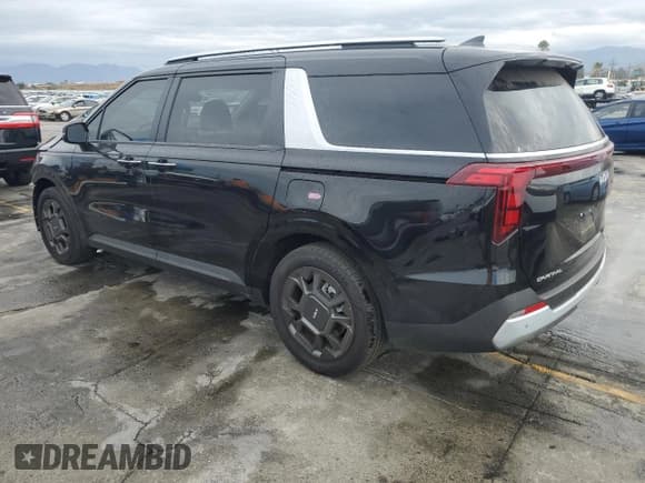 ✅ 2025 Kia Carnival EX • VIN: KNDNC5KA9S6033790 • Lot: 80074095. Listed on Copart with 12,855 mi. Free auction sales archive from the USA and detailed vehicle history report at DreamBid. Image 2.