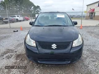 ✅ 2013 Suzuki SX4 LE • VIN: JS2YC5A31D6102366 • Lot: 43660138. Wystawiony na IAAI z przebiegiem 117 339 mil. Bezpłatny archiwum sprzedaży aukcyjnych z USA i szczegółowy raport historii pojazdu na DreamBid. Zdjęcie 6.