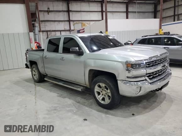 2017 Chevrolet Silverado 1500 LTZ with VIN 3GCUKSEC5HG358678, listed as a Copart auction lot 82119185 with 143,998 mi miles and Salvage title. Bid and sale history available at DreamBid. Image 4.