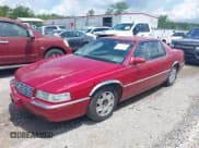 ✅ 2001 Cadillac Eldorado ESC • VIN: 1G6EL12Y31B107932 • Lot: 42723296. Wystawiony na IAAI z przebiegiem 152 482 mil. Bezpłatny archiwum sprzedaży aukcyjnych z USA i szczegółowy raport historii pojazdu na DreamBid. Zdjęcie 2.