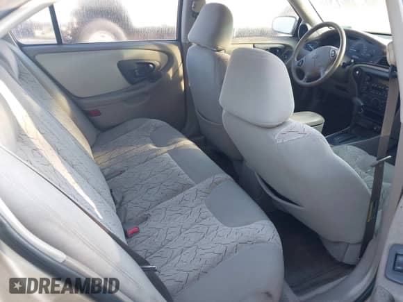 2003 Chevrolet Malibu LS z VIN 1G1NE52J03M619746, wystawiony jako IAAI lot #41471040 z przebiegiem 112 192 mil mil oraz . Historia ofert i sprzedaży dostępna na DreamBid. Obrazek 8.