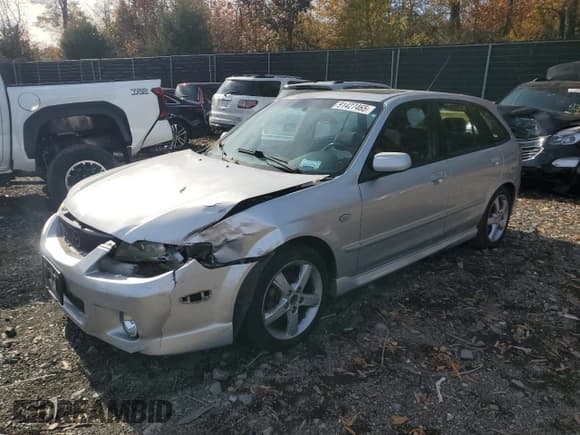 ✅ 2003 Mazda Protege • VIN: JM1BJ245031170736 • Лот: 91427465. Опубликован ранее на Copart с пробегом Не указан. Бесплатный доступ к архиву аукционных продаж из США и подробный отчёт об истории автомобиля на DreamBid. Изображение 1.