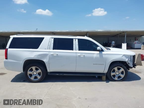 ✅ 2020 Chevrolet Suburban LT • VIN: 1GNSCHKC6LR287101 • Lot: 42310577. Wystawiony na IAAI z przebiegiem 79 903 mil. Bezpłatny archiwum sprzedaży aukcyjnych z USA i szczegółowy raport historii pojazdu na DreamBid. Zdjęcie 14.