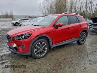 ✅ 2016 Mazda CX-5 Grand Touring • VIN: JM3KE4DY4G0703846 • Lot: 93990465. Wystawiony na Copart z przebiegiem 86 638 mil. Bezpłatny archiwum sprzedaży aukcyjnych z USA i szczegółowy raport historii pojazdu na DreamBid. Zdjęcie 1.