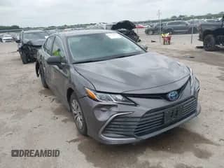 2022 Toyota Camry Hybrid LE z VIN 4T1C31AK6NU591599, wystawiony jako IAAI lot #42122052 z przebiegiem 87 292 mil mil oraz . Historia ofert i sprzedaży dostępna na DreamBid. Obrazek 1.