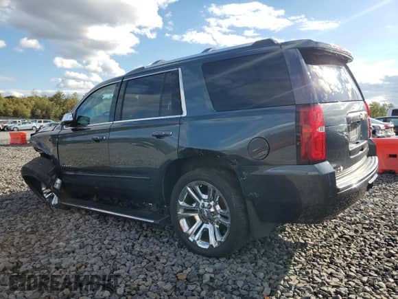 2020 Chevrolet Tahoe Premier with VIN 1GNSKCKJ0LR101198, listed as a Copart auction lot 84955895 with 99,414 mi miles and Salvage title. Bid and sale history available at DreamBid. Image 2.