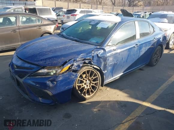 2023 Toyota Camry SE with VIN 4T1G11BK5PU105423, listed as a IAAI auction lot 41414587 with 38,527 mi miles and . Bid and sale history available at DreamBid. Image 2.