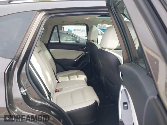 ✅ 2016 Mazda CX-5 Grand Touring • VIN: JM3KE4DY6G0672342 • Lot: 43581193. Wystawiony na IAAI z przebiegiem 94 680 mil. Bezpłatny archiwum sprzedaży aukcyjnych z USA i szczegółowy raport historii pojazdu na DreamBid. Zdjęcie 8.