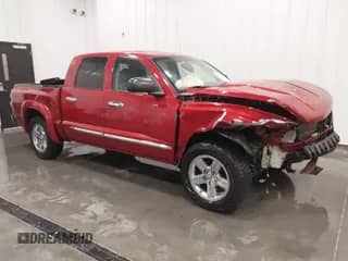 2010 Dodge Dakota z VIN 1D7CE5GP5AS100833, wystawiony jako IAAI lot #41575402 z przebiegiem 103 628 mil mil oraz . Historia ofert i sprzedaży dostępna na DreamBid. Obrazek 1.