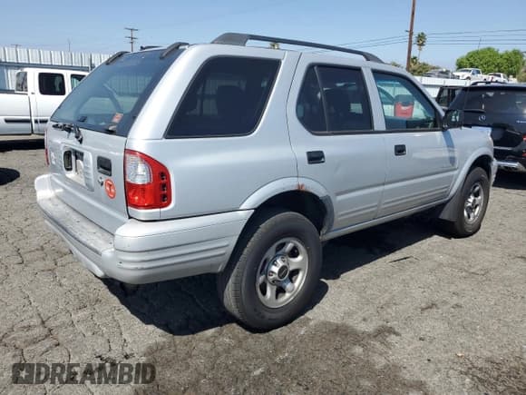 ✅ 2003 Isuzu Rodeo • VIN: 4S2CK58WX34303589 • Lot: 80560275. Listed on Copart with 112,637 mi. Free auction sales archive from the USA and detailed vehicle history report at DreamBid. Image 3.