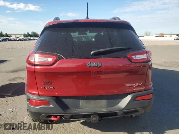 ✅ 2015 Jeep Cherokee Trailhawk • VIN: 1C4PJMBS0FW563072 • Lot: 92593655. Listed on Copart with 64,401 mi. Free auction sales archive from the USA and detailed vehicle history report at DreamBid. Image 6.
