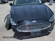 ✅ 2019 Ford Fusion Titanium • VIN: 3FA6P0D91KR121207 • Lot: 71102685. Wystawiony na Copart z przebiegiem 321 572 mil. Bezpłatny archiwum sprzedaży aukcyjnych z USA i szczegółowy raport historii pojazdu na DreamBid. Zdjęcie 13.