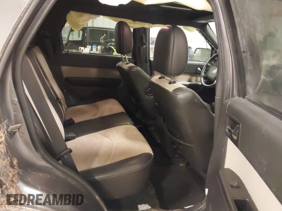 ✅ 2010 Mercury Mariner Premier • VIN: 4M2CN9HGXAKJ11983 • Lot: 41512060. Listed on IAAI with 154,971 mi. Free auction sales archive from the USA and detailed vehicle history report at DreamBid. Image 8.
