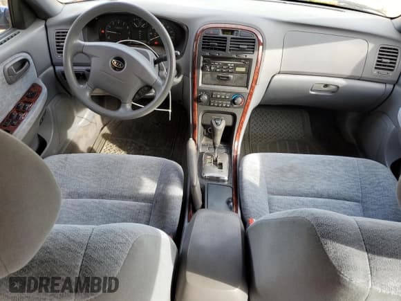 ✅ 2005 Kia Optima LX • VIN: KNAGD128955423159 • Lot: 84280734. Listed on Copart with 92,428 mi. Free auction sales archive from the USA and detailed vehicle history report at DreamBid. Image 8.