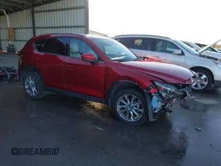 ✅ 2019 Mazda CX-5 Grand Touring • VIN: JM3KFBDM5K0623284 • Lot: 43656731. Wystawiony na IAAI z przebiegiem 32 220 mil. Bezpłatny archiwum sprzedaży aukcyjnych z USA i szczegółowy raport historii pojazdu na DreamBid. Zdjęcie 1.