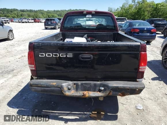 2003 Dodge Dakota SLT z VIN 1D7HL48X13S201942, wystawiony jako Copart lot #57829145 z przebiegiem 212 912 mil mil oraz Szkoda całkowita • Salvage title. Historia ofert i sprzedaży dostępna na DreamBid. Obrazek 6.