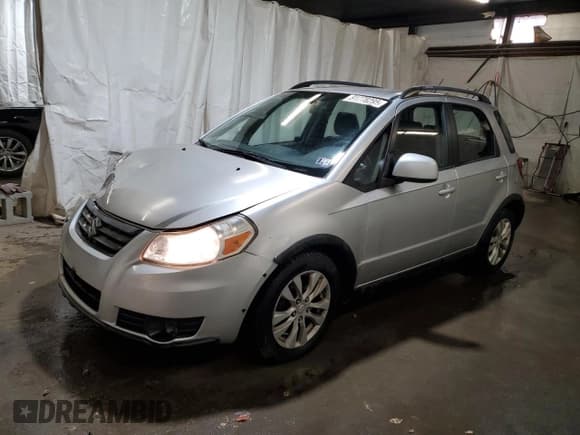 ✅ 2013 Suzuki SX4 Crossover • VIN: JS2YB5A31D6102256 • Лот: 91778295. Опубликован ранее на Copart с пробегом 209 702 миль. Бесплатный доступ к архиву аукционных продаж из США и подробный отчёт об истории автомобиля на DreamBid. Изображение 1.