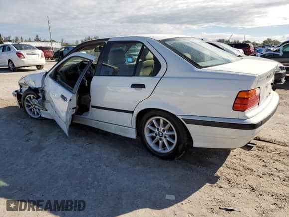 1998 BMW 3 Series 328i with VIN WBACD4322WAV64531, listed as a Copart auction lot 47091785 with 394,082 mi miles and Salvage title. Bid and sale history available at DreamBid. Image 2.