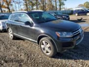 ✅ 2013 Volkswagen Touareg Sport • VIN: WVGEP9BP8DD004176 • Lot: 87032895. Listed on Copart with 169,033 mi. Free auction sales archive from the USA and detailed vehicle history report at DreamBid. Image 4.