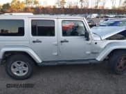 ✅ 2011 Jeep Wrangler Unlimited Sahara • VIN: 1J4HA5H12BL558910 • Лот: 43720477. Опубликован ранее на IAAI с пробегом 156 628 миль. Бесплатный доступ к архиву аукционных продаж из США и подробный отчёт об истории автомобиля на DreamBid. Изображение 13.