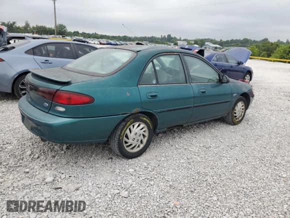 ✅ 1997 Ford Escort LX • VIN: 1FALP13P1VW274972 • Lot: 69434745. Listed on Copart with 185,562 mi. Free auction sales archive from the USA and detailed vehicle history report at DreamBid. Image 3.