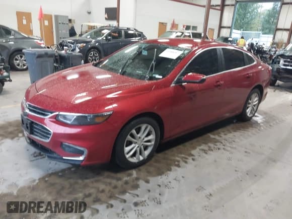 ✅ 2016 Chevrolet Malibu Hybrid • VIN: 1G1ZJ5SU0GF310084 • Lot: 43388707. Listed on IAAI with 141,678 mi. Free auction sales archive from the USA and detailed vehicle history report at DreamBid. Image 2.