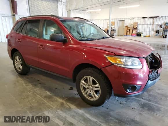 2012 Hyundai Santa Fe GLS with VIN 5XYZGDAB7CG129958, listed as a Copart auction lot 70648355 with 164,473 mi miles and Salvage title. Bid and sale history available at DreamBid. Image 4.