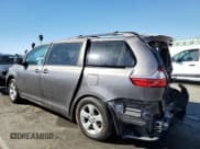 ✅ 2015 Toyota Sienna LE • VIN: 5TDKK3DC8FS643145 • Lot: 87252135. Listed on Copart with 176,574 mi. Free auction sales archive from the USA and detailed vehicle history report at DreamBid. Image 2.