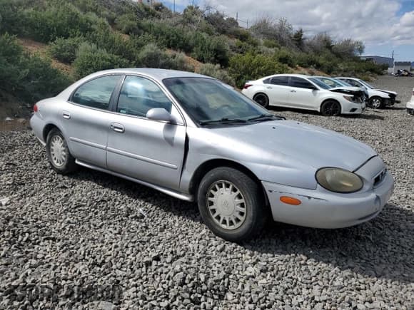 ✅ 1999 Mercury Sable GS • VIN: 1MEFM50U7XG650801 • Lot: 56764005. Listed on Copart with 190,763 mi. Free auction sales archive from the USA and detailed vehicle history report at DreamBid. Image 4.