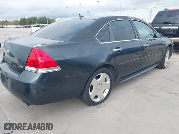 ✅ 2014 Chevrolet Impala LTZ • VIN: 2G1WC5E3XE1189956 • Lot: 43718567. Listed on IAAI with 142,559 mi. Free auction sales archive from the USA and detailed vehicle history report at DreamBid. Image 4.