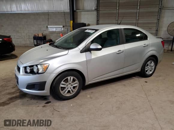2012 Chevrolet Sonic LS with VIN 1G1JA5SHXC4152634, listed as a Copart auction lot 70631965 with 143,934 mi miles and Salvage title. Bid and sale history available at DreamBid. Image 1.