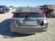✅ 2014 Honda Insight LX • VIN: JHMZE2H55ES003118 • Лот: 73066964. Опубликован ранее на Copart с пробегом 56 870 миль. Бесплатный доступ к архиву аукционных продаж из США и подробный отчёт об истории автомобиля на DreamBid. Изображение 6.
