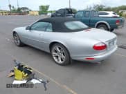 ✅ 2003 Jaguar XK • VIN: SAJDA42C232A34869 • Lot: 42058494. Listed on IAAI with 33,868 mi. Free auction sales archive from the USA and detailed vehicle history report at DreamBid. Image 3.