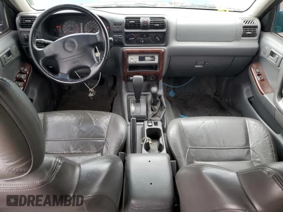 ✅ 1999 Isuzu Rodeo S • VIN: 4S2CM58W5X4313060 • Lot: 62211235. Wystawiony na Copart z przebiegiem 157 222 mil. Bezpłatny archiwum sprzedaży aukcyjnych z USA i szczegółowy raport historii pojazdu na DreamBid. Zdjęcie 8.