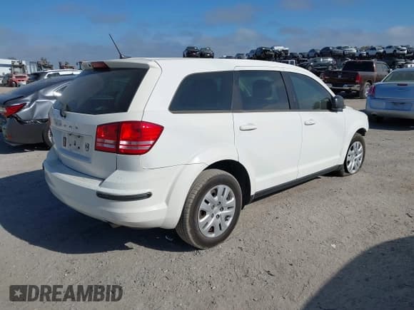 ✅ 2014 Dodge Journey SE • VIN: 3C4PDCAB0ET315332 • Lot: 43542775. Listed on IAAI with 158,494 mi. Free auction sales archive from the USA and detailed vehicle history report at DreamBid. Image 4.