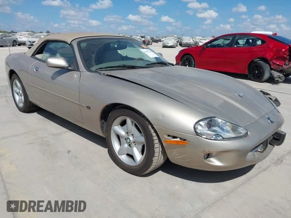 ✅ 1997 Jaguar XK • VIN: SAJGX2744VC004588 • Lot: 43457138. Listed on IAAI with 92,020 mi. Free auction sales archive from the USA and detailed vehicle history report at DreamBid. Image 1.