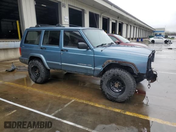 ✅ 1999 Jeep Cherokee Sport • VIN: 1J4FF68S4XL583029 • Lot: 52030175. Listed on Copart with 294,502 mi. Free auction sales archive from the USA and detailed vehicle history report at DreamBid. Image 4.