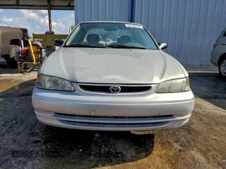 ✅ 1999 Toyota Corolla LE • VIN: 1NXBR12E4XZ193524 • Lot: 94130255. Listed on Copart with Not provided. Free auction sales archive from the USA and detailed vehicle history report at DreamBid. Image 5.