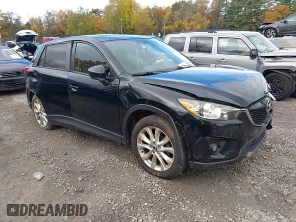 ✅ 2014 Mazda CX-5 Grand Touring • VIN: JM3KE4DY4E0303895 • Lot: 43521420. Listed on IAAI with 167,219 mi. Free auction sales archive from the USA and detailed vehicle history report at DreamBid. Image 1.