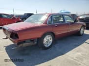 ✅ 1995 Jaguar XJ • VIN: SAJKX1744SC720830 • Lot: 69212295. Listed on Copart with 77,847 mi. Free auction sales archive from the USA and detailed vehicle history report at DreamBid. Image 3.