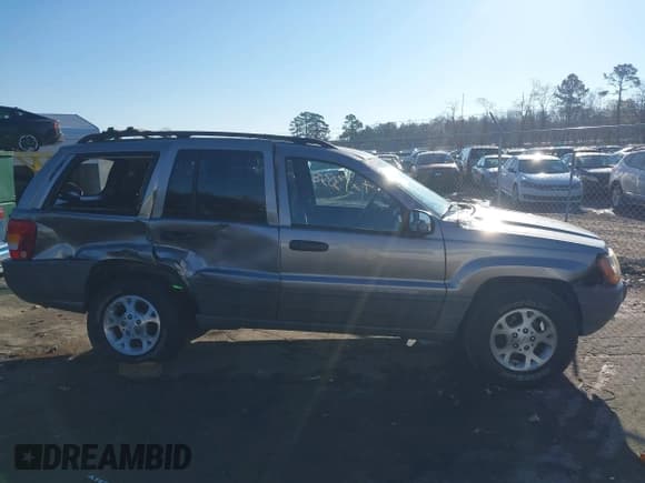 ✅ 1999 Jeep Grand Cherokee Laredo • VIN: 1J4GW58S1XC520727 • Lot: 43730318. Wystawiony na IAAI z przebiegiem 154 356 mil. Bezpłatny archiwum sprzedaży aukcyjnych z USA i szczegółowy raport historii pojazdu na DreamBid. Zdjęcie 13.
