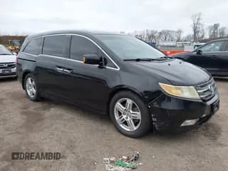 ✅ 2011 Honda Odyssey Touring • VIN: 5FNRL5H90BB014208 • Lot: 43682256. Listed on IAAI with 169,536 mi. Free auction sales archive from the USA and detailed vehicle history report at DreamBid. Image 1.