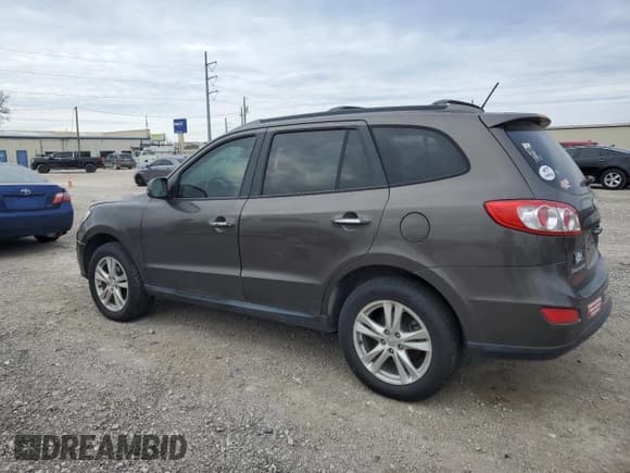 ✅ 2012 Hyundai Santa Fe Limited • VIN: 5XYZK4AG1CG156812 • Lot: 87953285. Listed on Copart with 186,428 mi. Free auction sales archive from the USA and detailed vehicle history report at DreamBid. Image 2.