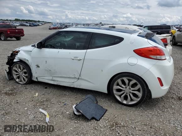 2012 Hyundai Veloster w/Red Int z VIN KMHTC6AD4CU083000, wystawiony jako Copart lot #53200115 z przebiegiem 123 074 mil mil oraz Szkoda całkowita • Salvage title. Historia ofert i sprzedaży dostępna na DreamBid. Obrazek 2.
