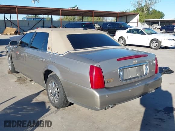 ✅ 2004 Cadillac DeVille DHS • VIN: 1G6KE57Y34U138359 • Lot: 43535083. Listed on IAAI with 84,329 mi. Free auction sales archive from the USA and detailed vehicle history report at DreamBid. Image 3.