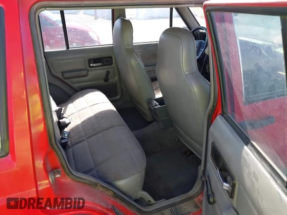 ✅ 1996 Jeep Cherokee Sport • VIN: 1J4FT68S0TL225719 • Lot: 42121351. Listed on IAAI with 237,602 mi. Free auction sales archive from the USA and detailed vehicle history report at DreamBid. Image 8.