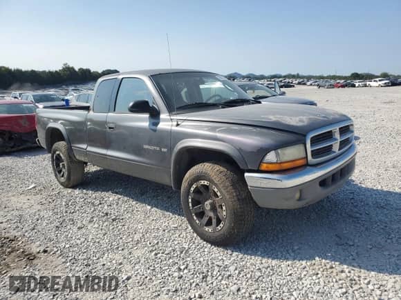 2001 Dodge Dakota Sport with VIN 1B7GG22N71S336152, listed as a Copart auction lot 70697244 with 256,693 mi miles and Salvage title. Bid and sale history available at DreamBid. Image 4.