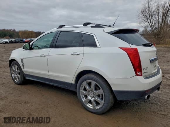 ✅ 2011 Cadillac SRX Premium Collection • VIN: 3GYFNFEY7BS634988 • Лот: 94653205. Опубликован ранее на Copart с пробегом 163 101 миль. Бесплатный доступ к архиву аукционных продаж из США и подробный отчёт об истории автомобиля на DreamBid. Изображение 2.