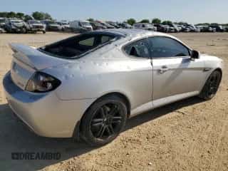 2008 Hyundai Tiburon GT с VIN KMHHN66F28U293287, выставлен на аукционе Copart как лот 52166005 с пробегом 106 072 миль миль и Чистый • Clean title. История ставок и продаж доступна на DreamBid. Изображение 3.
